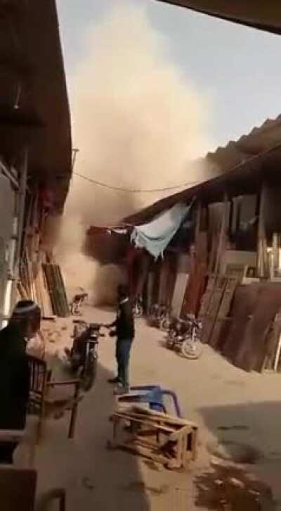 A 15 year old 6 story building tilted, giving the people living in it time to evacuate before it collapsed. Karachi, Pakistan - Dec 30, 2019