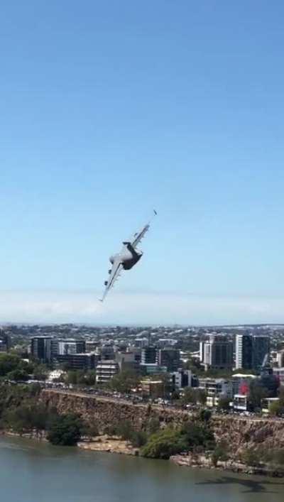 C-17A Globemaster flying through Brisbane CBD.