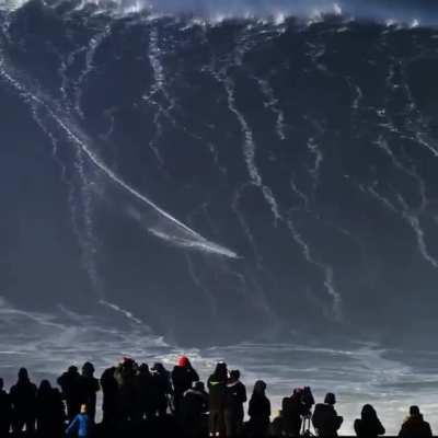 Brazilian surfer Rodrigo Koxa rides a massive wave in Nazare