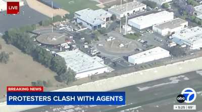 A military Blackhawk helicopter is unloading dozens of boxes of weapons and ammunition in Los Angeles “as if they were getting ready for a major battle.”