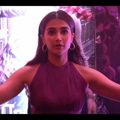 Pooja is interviewed about her birthday. She sat in front of a lamp... As she gestured on her cake size, the lights from the lamp reflected off her armpits, revealing how wet her armpits are!