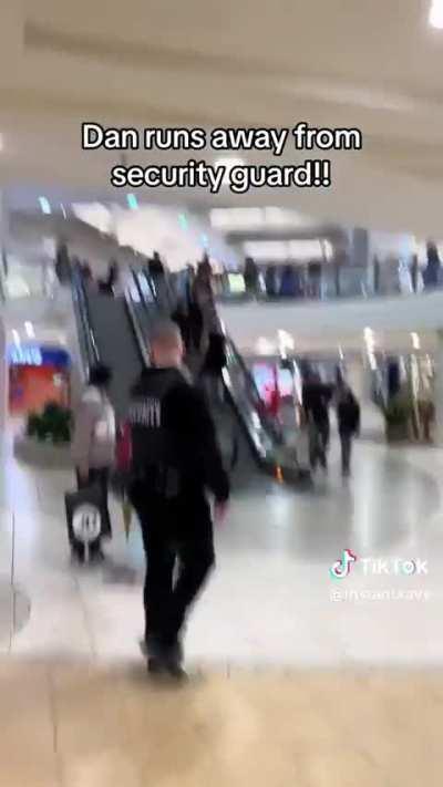 Tiktoker Dan.The.Man.With running through a mall to evade security  