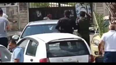 Suicde grenadier outside a syrian embassy gate or courthouse