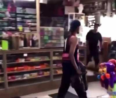 Guy fighting a plastic barrier gets bottled for his trouble