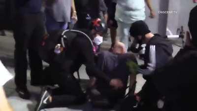 BLMers/anti-police protesters sucker punch man holding a dog multiple times, street 