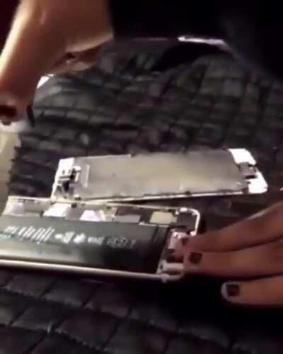 Kid cuts open phone battery