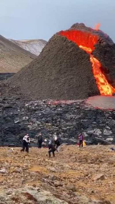 Casually playing volleyball as a volcano erupts in the background. What did you do for fun today?