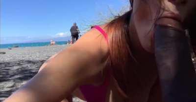 Naughty blowjob on public beach