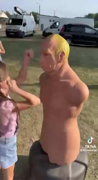 Ukrainian kids hitting Putin doll to a pulp. I want to go next.