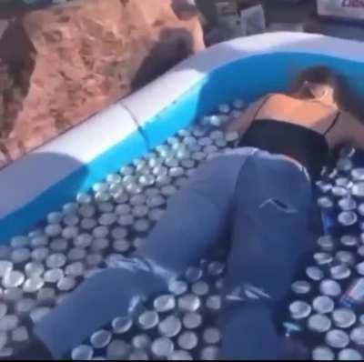 HMB as I jump into a kiddie pool completely full of beer cans