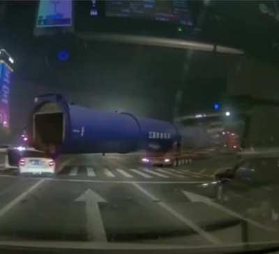Truck crushes a car when making a turn