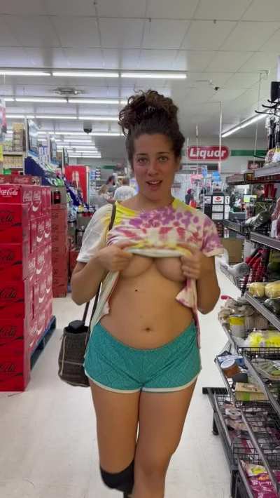 A naughty flash in a busy supermarket