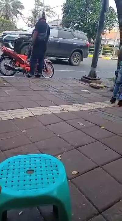 Headbutting someone with helmet