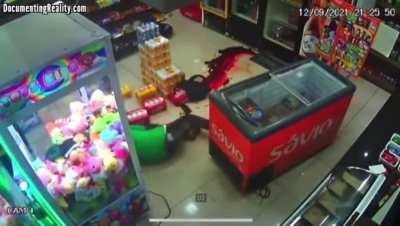 Thief accidentally shoots himself in the neck with his own gun during robbery.