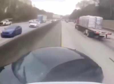 Car cuts off semi truck and causes it to flip over onto it a a