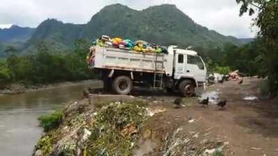 Garbage being dumped directly into the Amazon river in Tingo Maria, Peru...Person that took video (Martin Hutchinson) threatened by the Government and forced to flee the country.