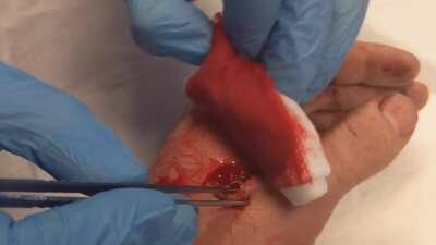 Hand cut on a wood saw