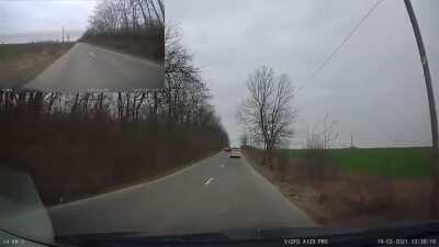 Idiot drives backward, pull gun on driver, looses cap, looses magazine and gets out of the window and blocks the whole road.