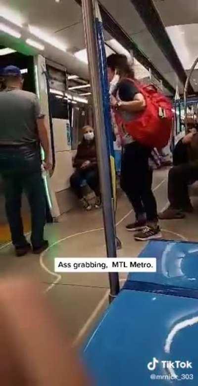 Creep sexually harasses a woman on the metro and is stopped by someone who kicks him off the train