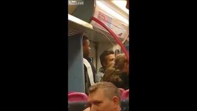 Man executing a citizens arrest, after man allegedly robbed then threatened to stab people on the train...headbutt makes quite the sound. (Satisfying)