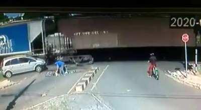 A Car and a Bicycle Both Try to Beat the Train