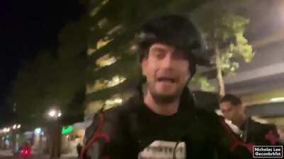 Mason the photographer getting confronted, and later beaten, for allegedly sending photos to the police