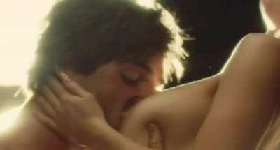 Getting her tits sucked