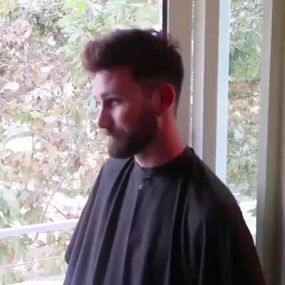 Watch as a toupee is applied.