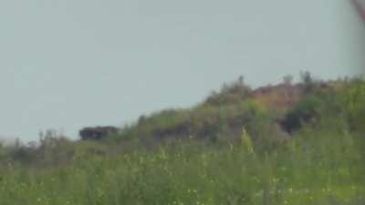 RU pov: Russian snipers hit two Ukrainian soldiers. One is hit in the head causing his helmet to come off.