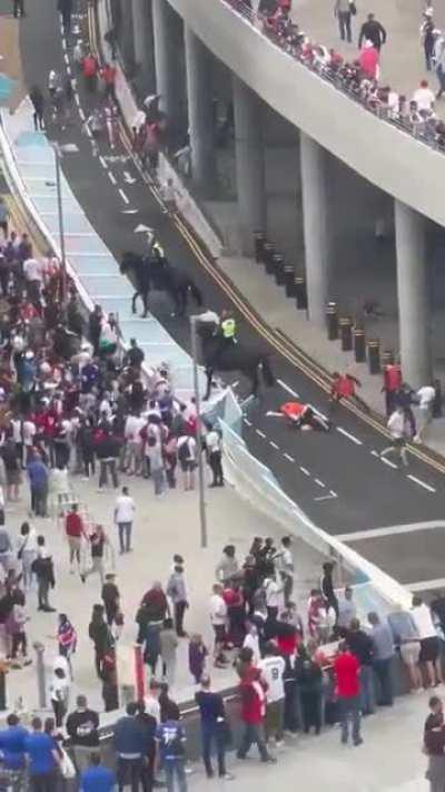 More fans knock down the gates and storm Wembley