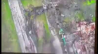 Drone drops grenade on a Russian vehicle (warning; Video zooms in on people dying). Shared originally on r/CombatFootage.