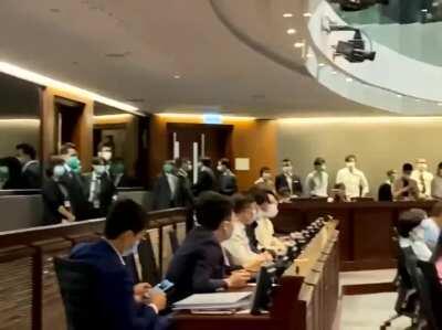 Earlier today, ballots for election of House Committee chairman were distributed to pro-Beijing lawmakers by Chan Kin-por, while evicted pro-democracy lawmakers were banging the doors held locked by LegCo security guards from inside.