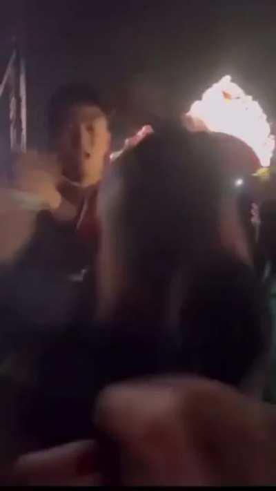 Guy throw the urine cup into the crowd