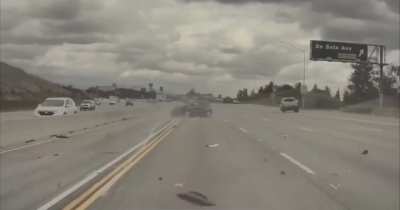 Truck loses its wheel and sends another car flying through the air