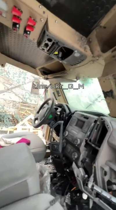 RU POV: American armored vehicle BATT in Marinka being towed away