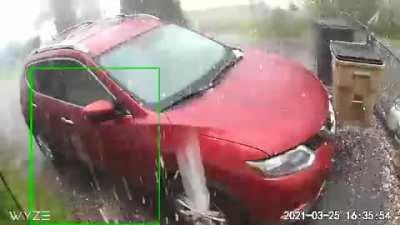 Hailstorm from security camera angle.
