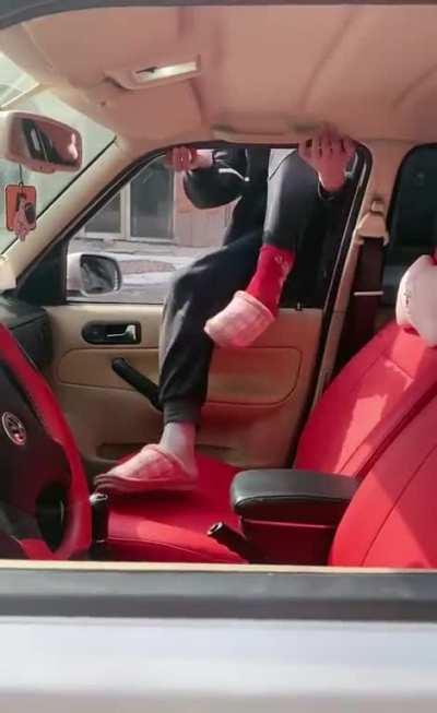 Trying to get inside the car.