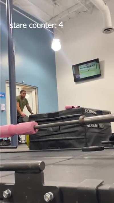 Influencer records man in gym while muttering to herself and staring at him; accuses him of being creepy when he glances at her and later offers to help her adjust her weights correctly