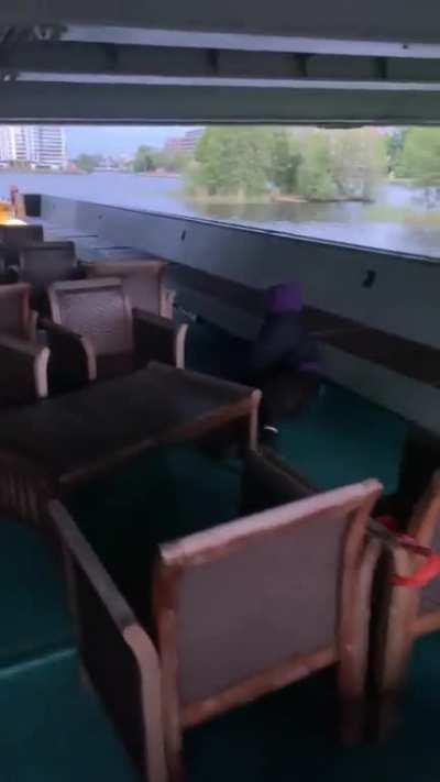 Trying to hang off a bridge from a boat