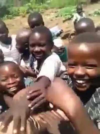 African children seeing a white man for the first time.