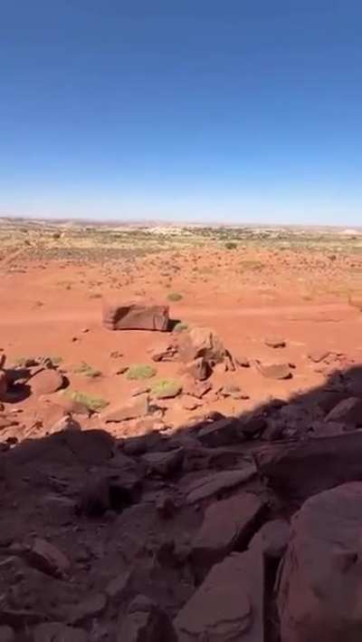 Men throw rock. Men happy