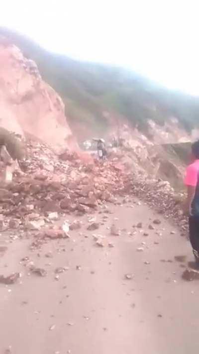 Perú: chaman witch tries to stop a land slide with superior power. 