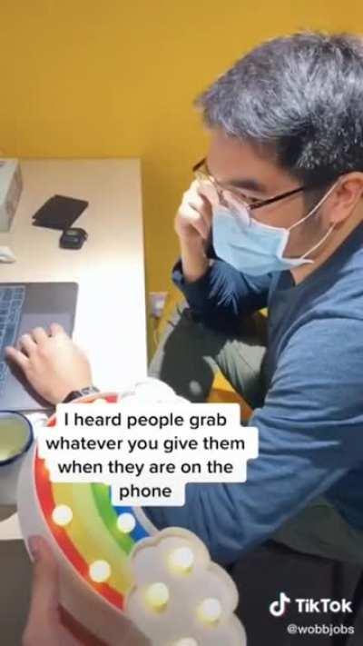 the sudden realization that you've grabbed a random item given by a co-worker while not paying attention