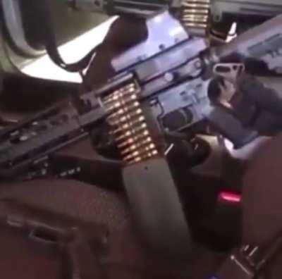 Belt fed with an Eotech, these guys evolving