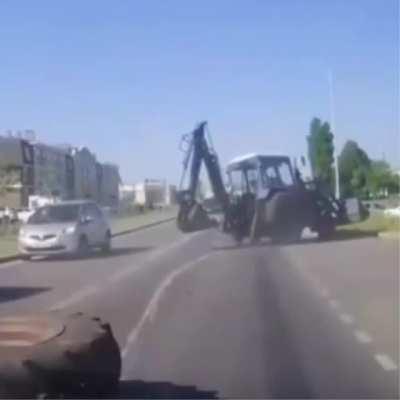 WCGW Driving an unmaintained backhoe on the highway.