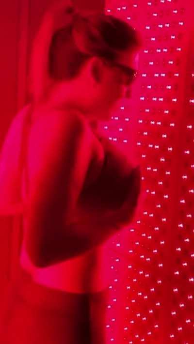 Lifting her gigantic tits