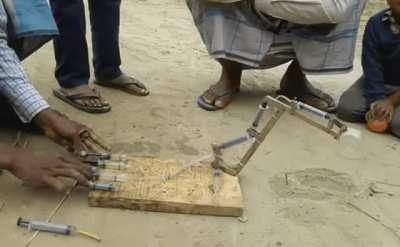 Toy excavator made from syringes.