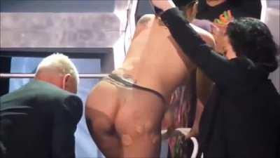 Lady Gaga changing on stage.