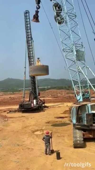 Compacting soil with a giant tamper (with sound)