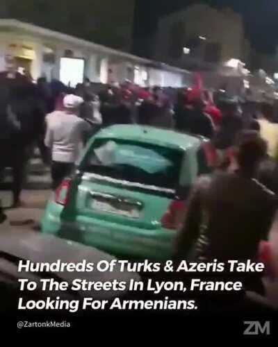 After a small group of French Armenians peacefully protested a group of hundreds of Turks marched through the streets and smashed Armenian businesses
